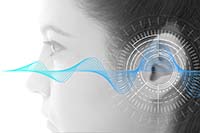 Abstract photo of sound waves entering a woman's ear